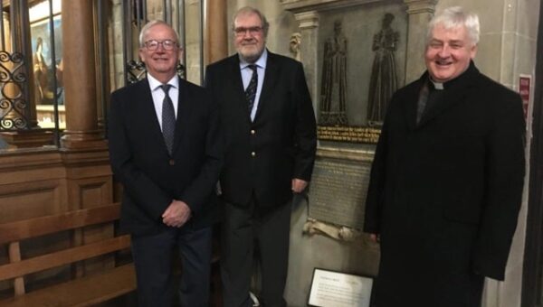 Clive Mason, chairman of Thomas Oken Charity with fellow trustee Terry Brown and the Rev Vaughan Roberts beside the Thomas Oken memorial plaque at St Mary's Church in Warwick